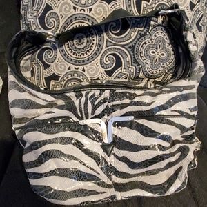 Super cute gently used hobo bag.